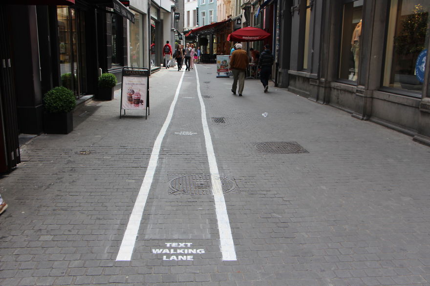 Phone-Addicts-Text-Walking-Lanes-In-Belgium