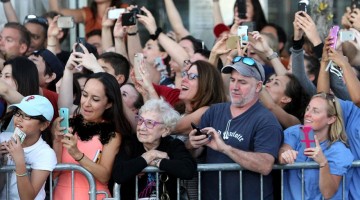 old-woman-living-in-moment-no-smartphone-celebrities-movie-premiere-black-mass
